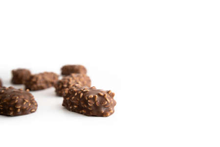 Chocolate candy bars wafers handmade lie on a white background.