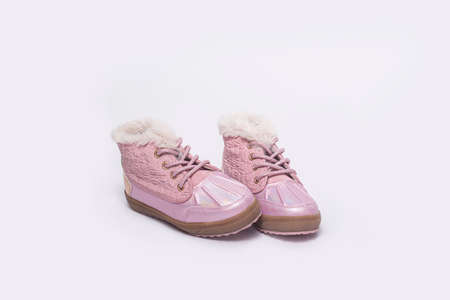 Fashionable children's boots for a girl on a white background