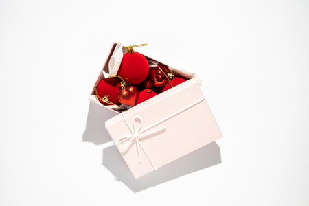 Gift wrapping with New Year's toys on a white background. Top view, flat lay.