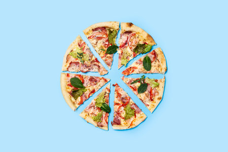 cut pizza fresh hot on a blue background. Top view, flat lay.の写真素材
