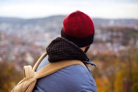 Young man looking at a panoramic view of the city.の写真素材