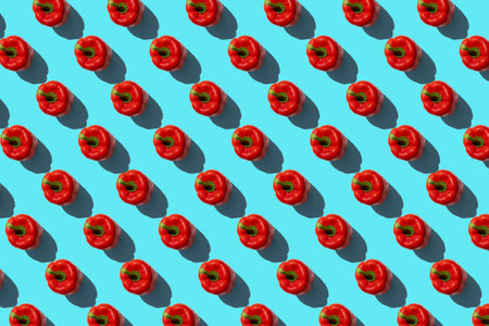 Red fresh paprika pepper on a blue background. Top view, flat lay.の写真素材