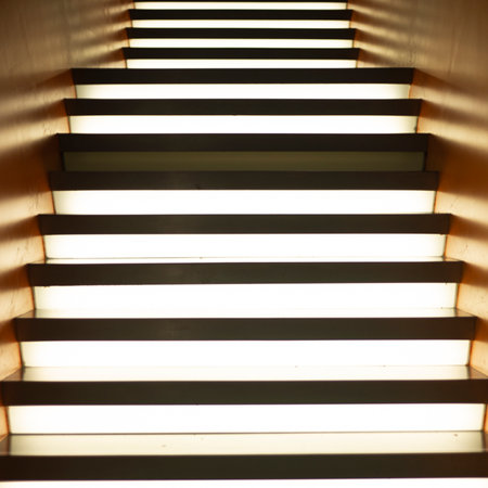 Staircase with led lighting leading up indoors, view from below.の写真素材