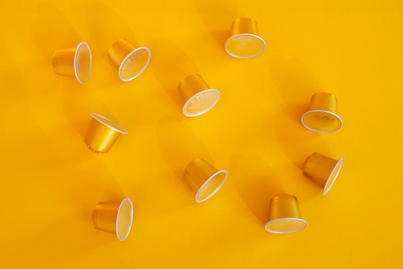 Coffee capsules on a yellow background. Top view, flat lay.の写真素材