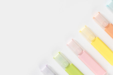 Colored markers felt-tip pens on a white background. Top view, flat lay.の写真素材