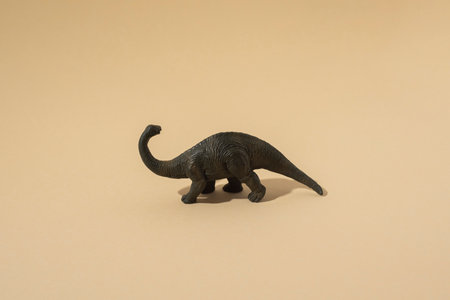 Plastic toy dinosaur on a light background.の写真素材