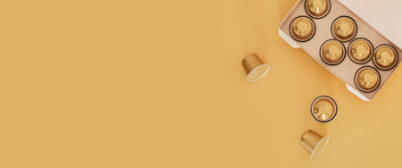 Coffee capsules in packaging on a light background. Top view, flat lay. Banner.の写真素材