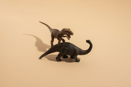 Plastic toy dinosaur on a light background.の写真素材