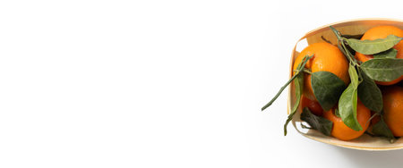 Fresh tangerine in a wooden package on a white background. Top view, flat lay.の写真素材