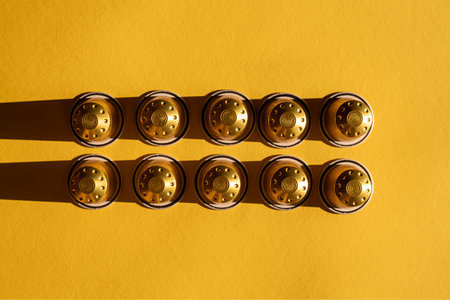 Coffee capsules under natural light on a yellow background. Top view, flat lay.の写真素材