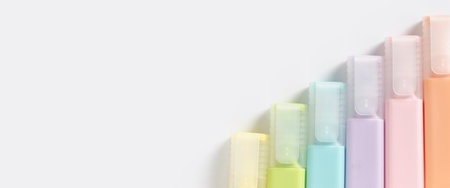 Colored markers pens on a white background. Top view, flat lay. Banner.の写真素材