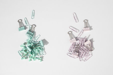 Stationery, paper clips, binders, buttons on a white background. Top view, flat lay.の写真素材