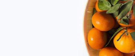 Fresh tangerines in a wooden package on a white background. Top view, flat lay.の写真素材
