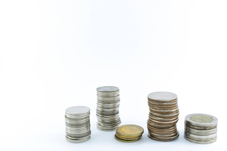 Baht Thailand coins stacked on white background.の写真素材