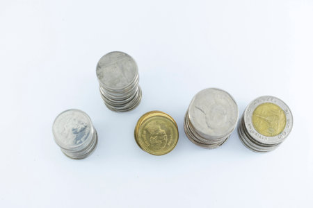 Baht Thailand coins stacked on white background.の写真素材