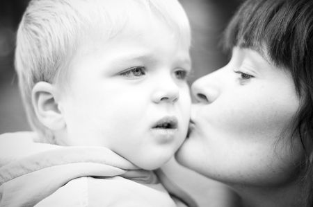Mother kissing her baby.の写真素材