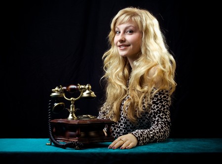 Caucasian woman talking on retro phone.の写真素材