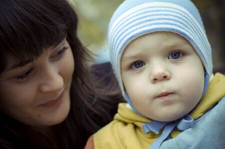 A young mother with her baby. close-upの写真素材