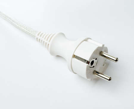 Electrical plug and cord on white background.の写真素材