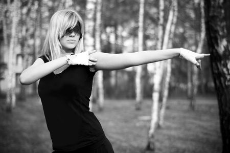girl limber up in a birch groveの写真素材