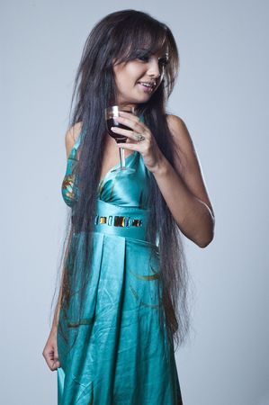 studio photos of a girl with a glass of wine の写真素材