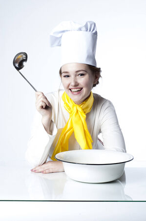 Photo of a girl cook with pan and bowl.の写真素材