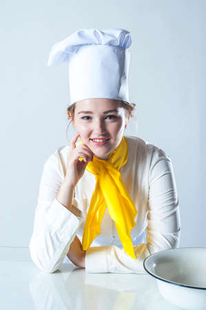 Photo of smiling girl cook with bowl.の写真素材