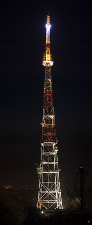 photo of shining communications TV tower at night.の写真素材