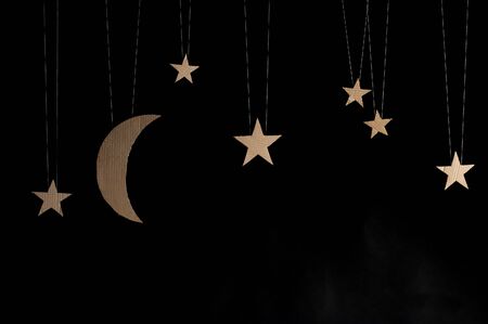 Hand made moon and stars on black background.の写真素材