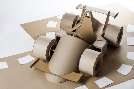 Photo of cardboard racing car on white backgroundの写真素材