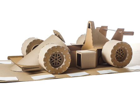Photo of cardboard racing car on white backgroundの写真素材