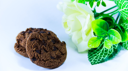 Cookies chocolate chips  and white rose