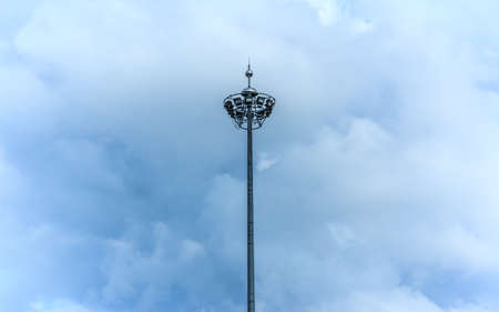 Light poles.For lighting at night. Seen on the streets and parks.