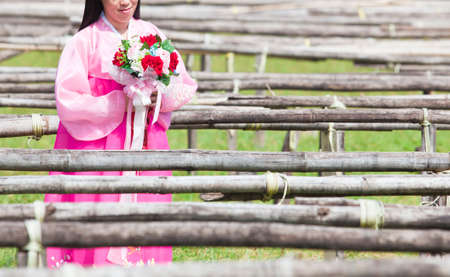 Korean girl with pink korean dressの写真素材