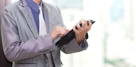 young business man touching tablet pc , New Technologyの写真素材