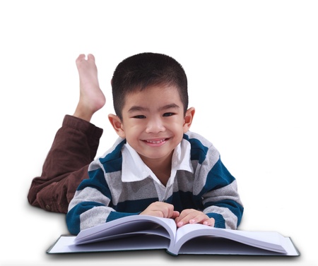 Asia boy smiles and read a bookの写真素材