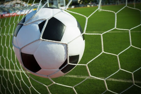 Soccer ball in goal, success conceptの写真素材