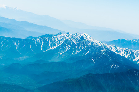 Snow Mountain Range Landscape with Blue Skyの写真素材