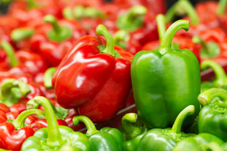 Red and green  sweet bell peppers natural background.の写真素材