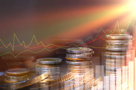 Double exposure of city and rows of coins for money, finance and business concept of teamwork and...