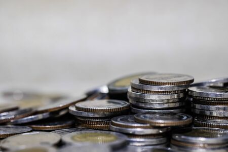 Financial investment concept, Double exposure of city night and stack of coins for finance investor,...