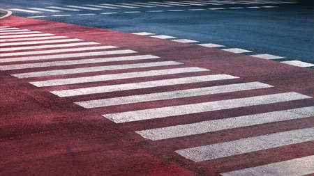 crosswalk on the road for safety when people walking cross the street, Pedestrian crossing on a repaired asphalt road, Crosswalk on the street for safety, logistic import export and transport industryの写真素材