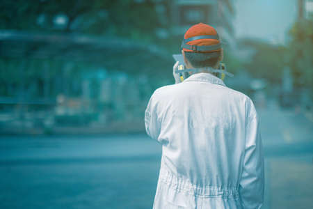 Man in protective suit, Surfaces are all sterilized from corona virus/ covid-19.の写真素材