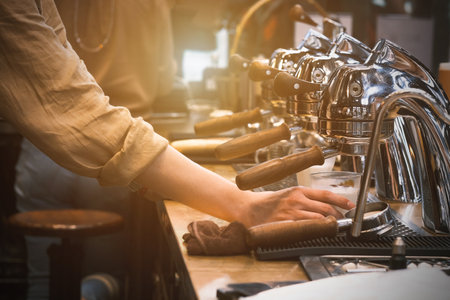 Espresso pouring from coffee machine. coffee machine preparing fresh coffee and pouring into red cups at restaurant, bar or pub. Brew coffeeの写真素材