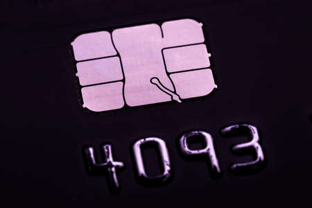 Close up of a micro sim card on a black background. Macro