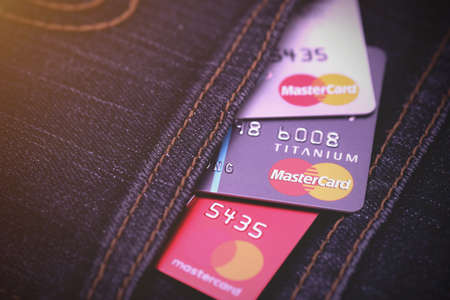 Close up of MasterCard credit cards in jeans pocket