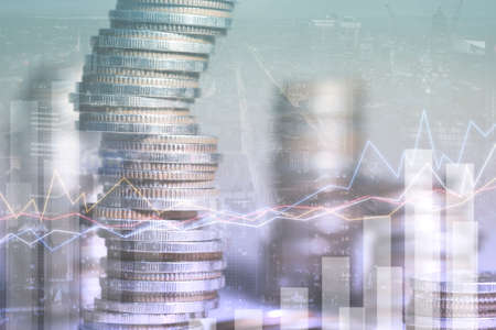 Double exposure of coins stacks with forex graph and cityscape background. Investment and trading...