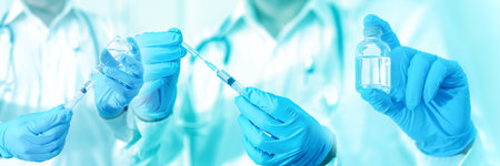 Doctor filling syringe with medication, covid-19 vaccine disease preparing for human clinical trials...
