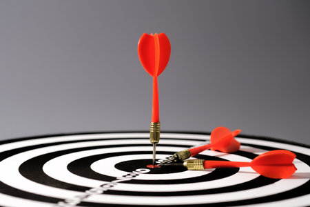 Goals concept - Smart goal setting, red three darts arrows in the target center business goal...