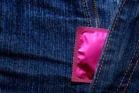Condom in package in jeans. Men found condoms to prevent sexually transmitted infections or AIDS. Prevent HIV disease. Sexually transmitted disease, And wallet.の写真素材
